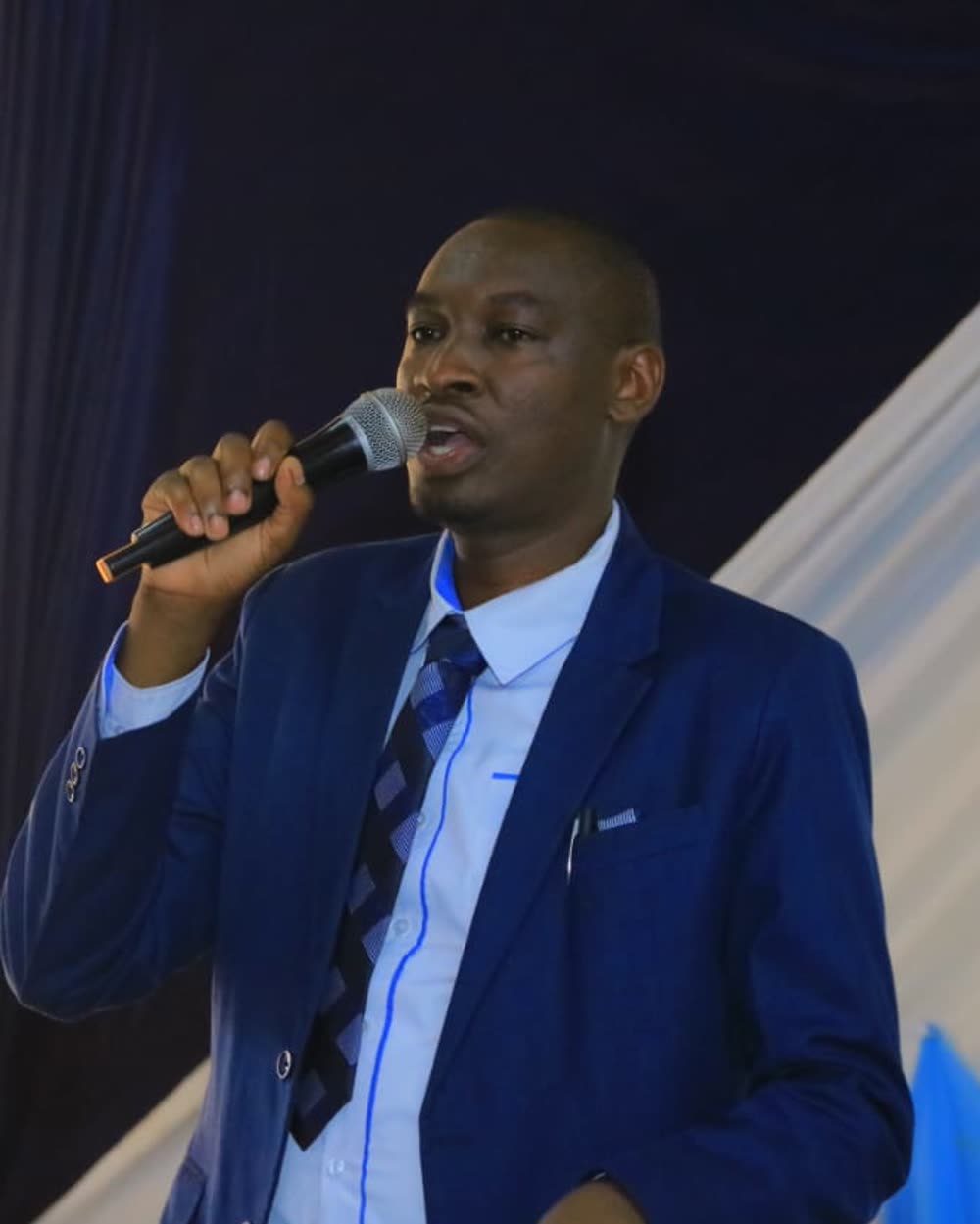 Patrick Maina Macharia speaking at a public meeting